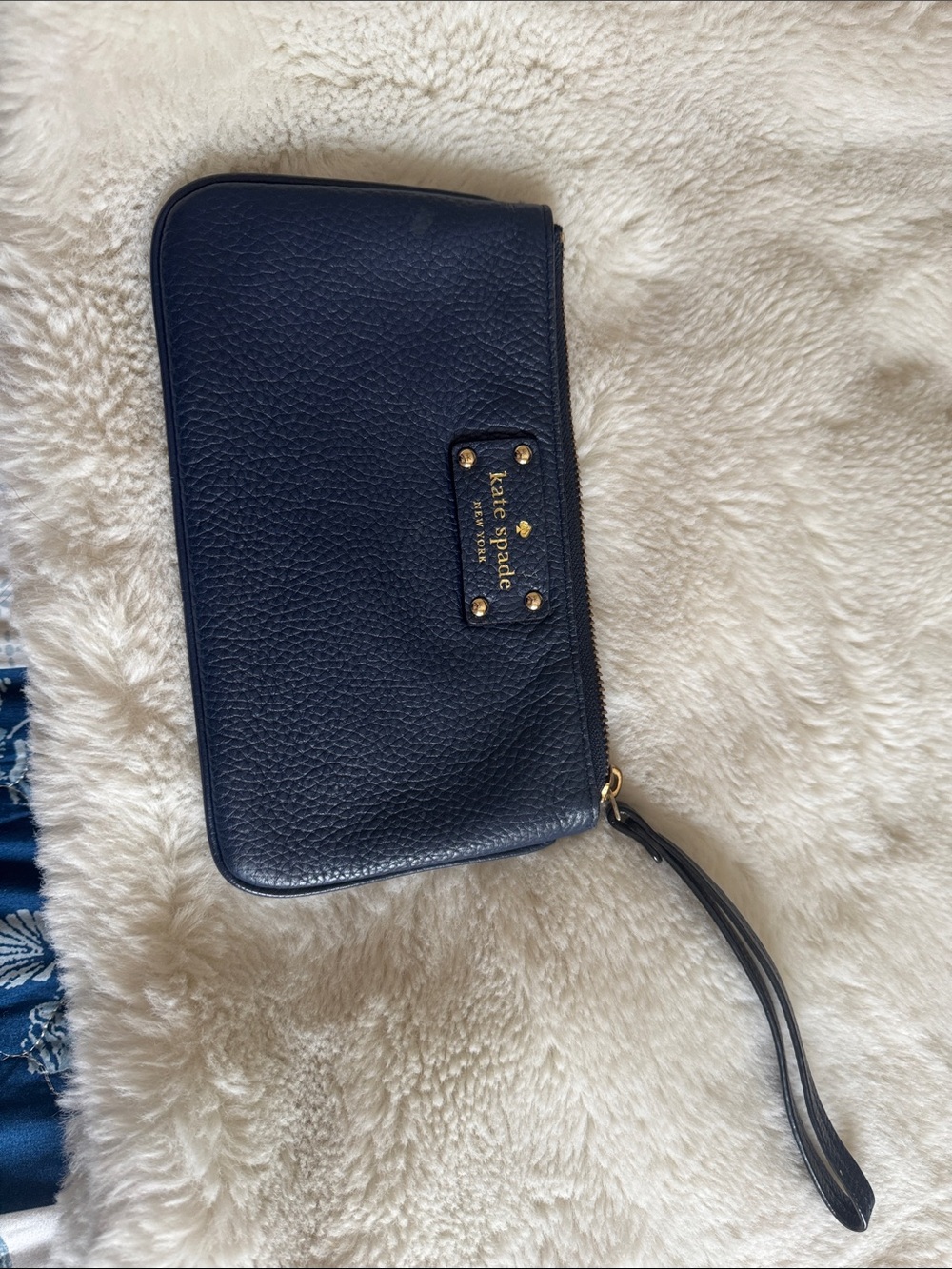 kate spade navy pebbled leather wristlet with gold logo